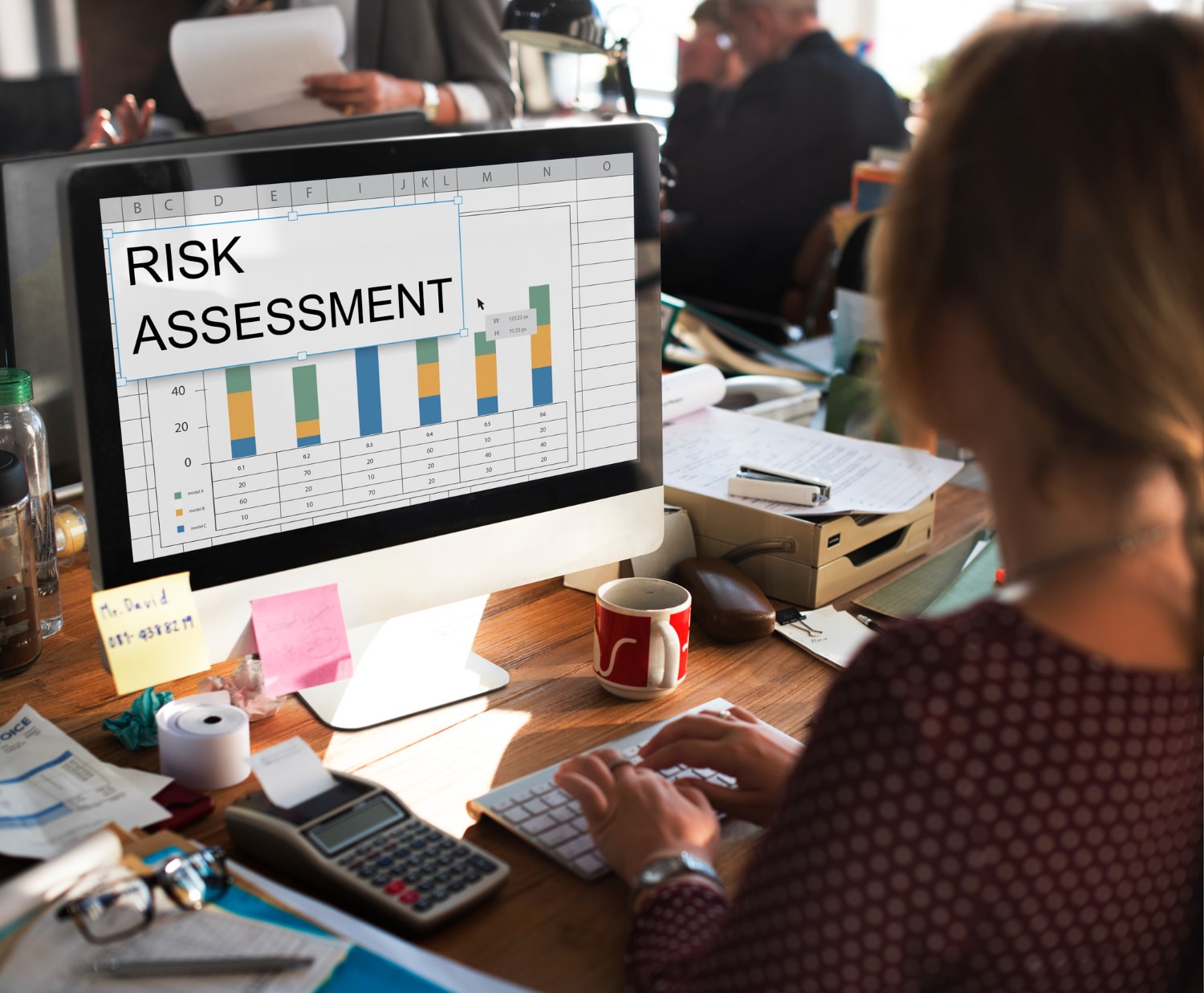 An image depicting a robust risk management plan showcases a project manager reviewing a risk matrix that outlines identified risks and potential threats to a software development project. The visual emphasizes key risk indicators and effective risk management strategies aimed at ensuring project success through proactive risk identification and mitigation.